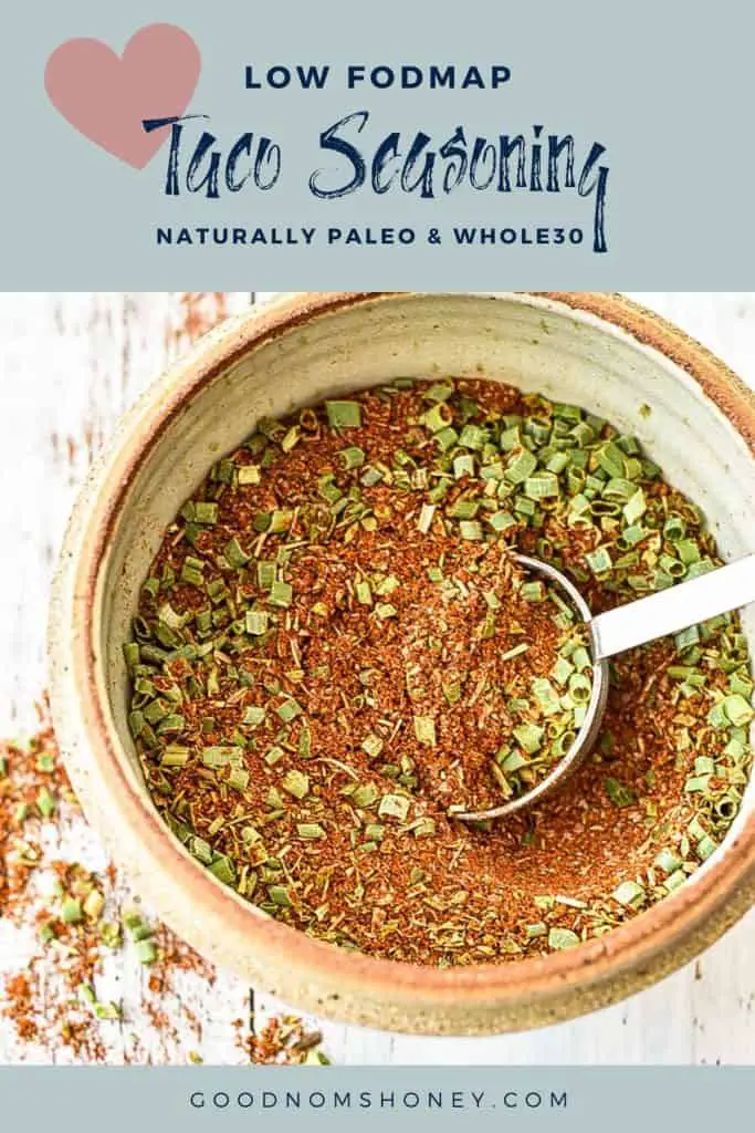 a bowl of low fodmap taco seasoning with low fodmap taco seasoning naturally paleo & whole30 written at the top and goodnomshoney.com at the bottom
