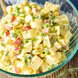 low fodmap keto faux potato salad in a clear bowl with a spoon