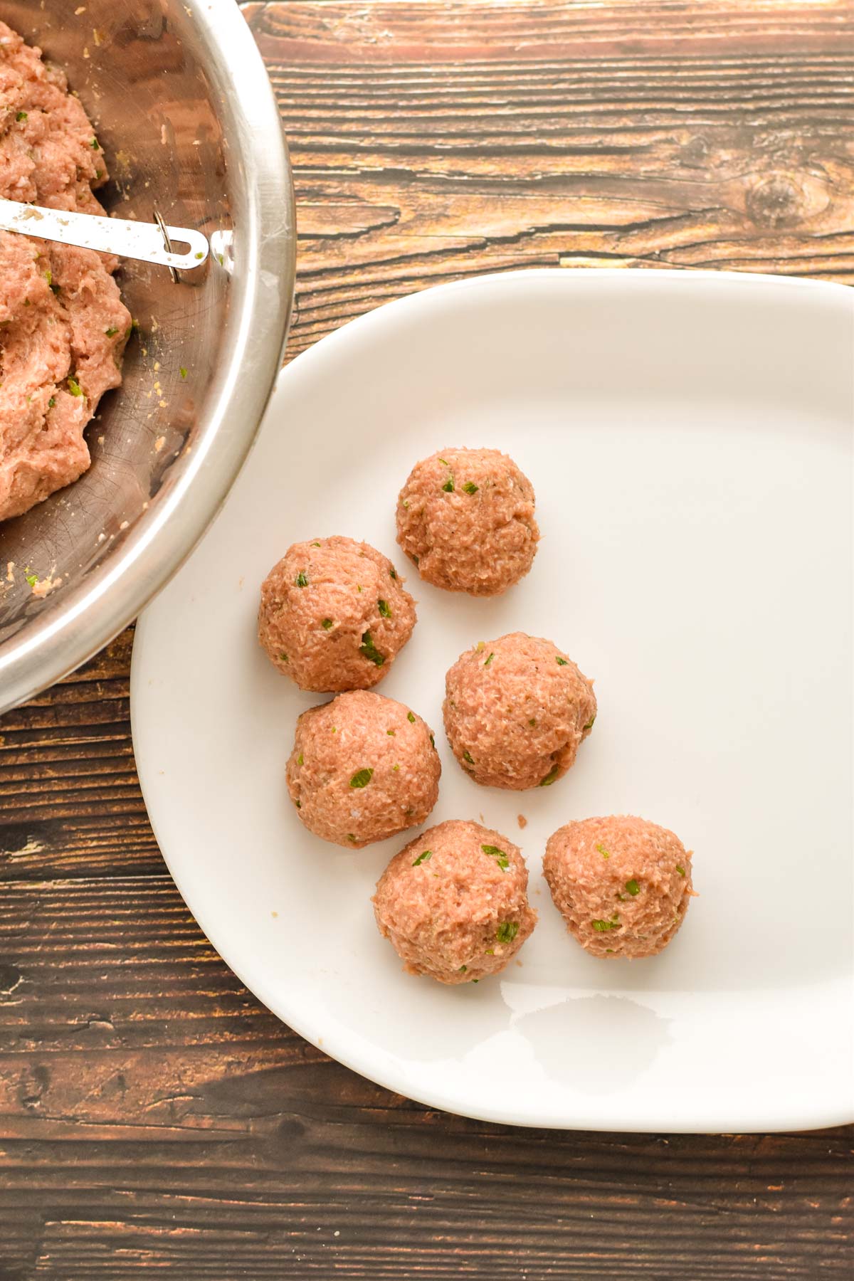 process shot of raw low fodmap turkey meatballs after they are formed into 2-tablespoon sized balls